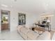 This living room offers modern design, stylish decor, and an inviting atmosphere with views of the backyard at 7385 Heron Canyon Ct, Las Vegas, NV 89117