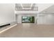 Bright and airy living room showcasing a modern fireplace, soaring ceilings, and seamless access to the patio at 7385 Heron Canyon Ct, Las Vegas, NV 89117