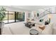 Modern living room with a large sliding glass door to the outdoor space at 7385 Heron Canyon Ct, Las Vegas, NV 89117