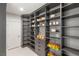 Spacious walk-in pantry with custom shelving, drawers, and organized storage for food and kitchen essentials at 7385 Heron Canyon Ct, Las Vegas, NV 89117