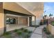 Stylish outdoor patio area with elegant landscaping, a sleek walkway, and access to indoor living spaces at 7385 Heron Canyon Ct, Las Vegas, NV 89117