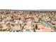 Wide aerial view showcasing neighborhood uniformity in housing style and color, creating a cohesive community appearance at 7445 Shangri La Ave, Las Vegas, NV 89147