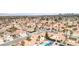 Expansive aerial view of a suburban neighborhood, showcasing uniform housing, landscaping, and street layout at 7445 Shangri La Ave, Las Vegas, NV 89147