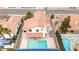 Home aerial view of a backyard featuring a swimming pool, patio area, and well-maintained landscaping at 7445 Shangri La Ave, Las Vegas, NV 89147