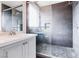 Bathroom with glass enclosed shower and updated vanity at 7445 Shangri La Ave, Las Vegas, NV 89147