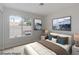 Comfortable bedroom with a large window, neutral decor, and ample natural light at 7445 Shangri La Ave, Las Vegas, NV 89147