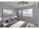 Bedroom features a cozy bed and window overlooking exterior scenery at 7445 Shangri La Ave, Las Vegas, NV 89147