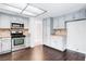 Functional kitchen with stainless steel appliances and granite countertops at 7445 Shangri La Ave, Las Vegas, NV 89147