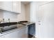 Practical laundry room equipped with modern appliances and ample storage space at 7445 Shangri La Ave, Las Vegas, NV 89147