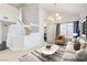 Virtually staged living room with vaulted ceilings and modern decor at 7445 Shangri La Ave, Las Vegas, NV 89147