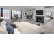Bright main bedroom features fireplace, desk, and large windows at 7445 Shangri La Ave, Las Vegas, NV 89147