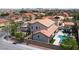 An aerial view of the house shows a beautiful backyard and pool surrounded by mature trees at 7569 Shadow Estates Way, Las Vegas, NV 89113