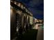 Outdoor living space with a patio, privacy wall decor, and subtle lighting for evening enjoyment at 7569 Shadow Estates Way, Las Vegas, NV 89113