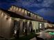 Outdoor living space with a patio, privacy wall decor, and subtle lighting for evening enjoyment at 7569 Shadow Estates Way, Las Vegas, NV 89113