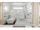 Elegant bathroom with a glass enclosed shower and tub featuring a modern design and stylish fixtures at 7569 Shadow Estates Way, Las Vegas, NV 89113