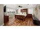 Bedroom with hardwood floors, a ceiling fan, and lots of natural light at 7569 Shadow Estates Way, Las Vegas, NV 89113