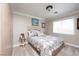 Cozy bedroom with neutral tones and comfortable-looking bed at 7569 Shadow Estates Way, Las Vegas, NV 89113