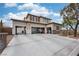 Expansive exterior showcasing a large driveway, three car garage, and beautifully landscaped front yard at 7569 Shadow Estates Way, Las Vegas, NV 89113