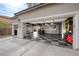 Spacious three car garage with epoxy flooring, storage cabinets and workbench, perfect for car enthusiasts or a workshop at 7569 Shadow Estates Way, Las Vegas, NV 89113
