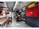 A custom garage interior with storage shelves and cabinets that maximize space and organization at 7569 Shadow Estates Way, Las Vegas, NV 89113