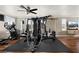 Home gym equipped with various exercise machines and hardwood floors at 7569 Shadow Estates Way, Las Vegas, NV 89113