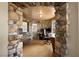 Unique home office featuring stone archway and wood ceiling at 7569 Shadow Estates Way, Las Vegas, NV 89113