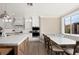 Bright, spacious kitchen with an island, a dining nook, and modern appliances at 7569 Shadow Estates Way, Las Vegas, NV 89113