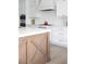 Kitchen featuring a center island, gas range, and custom white cabinetry at 7569 Shadow Estates Way, Las Vegas, NV 89113