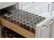 Organized spice rack in a pull-out drawer within the kitchen's cabinetry at 7569 Shadow Estates Way, Las Vegas, NV 89113