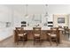 Bright kitchen island with bar seating, pendant lighting, and stainless steel appliances at 7569 Shadow Estates Way, Las Vegas, NV 89113