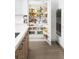 Custom kitchen features a fully stocked refrigerator with a built-in oven and cabinets at 7569 Shadow Estates Way, Las Vegas, NV 89113