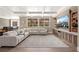 Spacious living room with a large sectional sofa, built-in entertainment center, and ample seating at 7569 Shadow Estates Way, Las Vegas, NV 89113