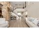 Grand foyer with soaring ceilings, a staircase, and an open floor plan to the living area at 7569 Shadow Estates Way, Las Vegas, NV 89113
