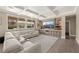Bright living room showcasing recessed lighting, a large window, and a custom entertainment center at 7569 Shadow Estates Way, Las Vegas, NV 89113