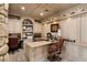 Home office featuring custom built-in cabinetry, desk space, and natural lighting at 7569 Shadow Estates Way, Las Vegas, NV 89113