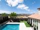 A gorgeous backyard featuring a pool, spa, and outdoor seating area with mountain views, perfect for relaxing and entertaining at 7569 Shadow Estates Way, Las Vegas, NV 89113