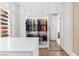 Organized walk-in closet with ample storage space, custom shelving, and modern design elements at 7569 Shadow Estates Way, Las Vegas, NV 89113