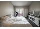 Bedroom featuring a bed, and a door to a balcony with a exercise machine at 7704 Himalayas Ave # 204, Las Vegas, NV 89128
