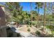 Scenic community park view featuring mature trees, and walking paths at 7704 Himalayas Ave # 204, Las Vegas, NV 89128