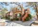 Charming multi-story condo with colorful facade and inviting entrance staircase at 7704 Himalayas Ave # 204, Las Vegas, NV 89128