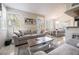 Open concept living and dining area with neutral color scheme and plenty of natural light at 7704 Himalayas Ave # 204, Las Vegas, NV 89128