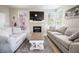 Comfortable living room with fireplace, TV, and plush seating, perfect for relaxing at 7704 Himalayas Ave # 204, Las Vegas, NV 89128