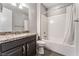 Bathroom features a granite countertop, modern fixtures, and a shower over tub at 7761 Boyd Ave, Las Vegas, NV 89179