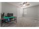 Bedroom features a ceiling fan, carpet, and a closet with sliding doors at 7761 Boyd Ave, Las Vegas, NV 89179
