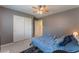Bedroom featuring plush carpet, ceiling fan, ensuite and sliding door closet at 7761 Boyd Ave, Las Vegas, NV 89179