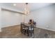 Neutral dining room featuring decorative lighting, table with chairs, and tile flooring at 7761 Boyd Ave, Las Vegas, NV 89179