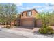 Charming two-story home with desert landscaping, brown exterior, and convenient three-car garage at 7761 Boyd Ave, Las Vegas, NV 89179