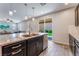 The kitchen offers granite countertops, stainless steel appliances, and backyard views at 7761 Boyd Ave, Las Vegas, NV 89179