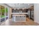 Spacious kitchen with granite countertops, stainless steel appliances, and a large center island at 7761 Boyd Ave, Las Vegas, NV 89179