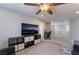 Upstairs living room features a TV and desk area with great natural light at 7761 Boyd Ave, Las Vegas, NV 89179